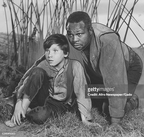 Former light-heavyweight boxing champion and actor Archie Moore and Eddie Hodges during the Broadway production of Mark Twain play Huckleberry Finn,...