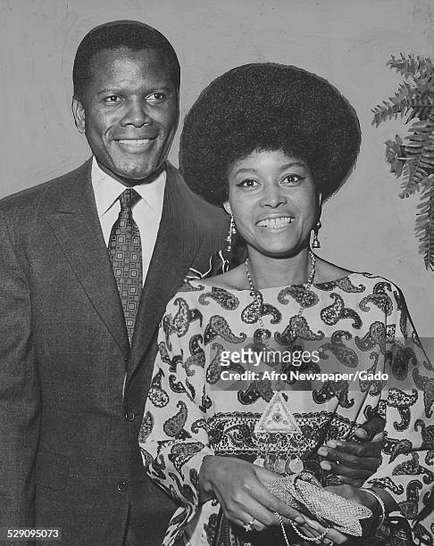 Actor, film director, author and diplomat Sidney Poitier and African-American jazz vocalist, songwriter and actress Abbey Lincoln standing, July 13,...