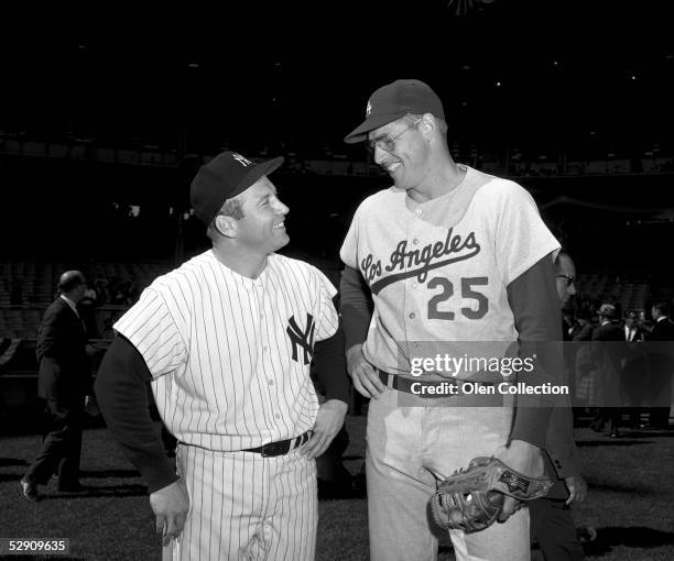 Mickey Mantle of the New York Yankees and Frank Howard of the Los Angeles Dodgers pose together prior to the start of Game 1 of the World Series on...