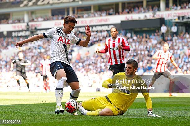 Son Heung-Min of Tottenham Hotspur beats Fraser Forster of Southampton on his way to scoring the opening goal during the Barclays Premier League...