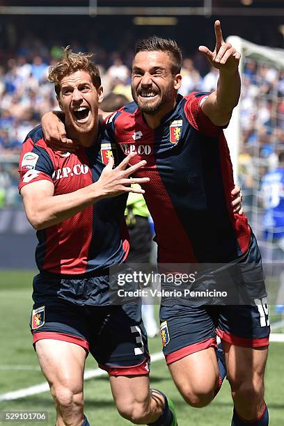 Leonardo Pavoletti of Genoa CFC celebrates after scoring the opening goal with team mate Cristian Ansaldi during the Serie A match between UC...