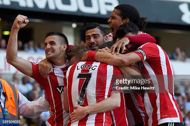Steven Davis of Southampton celebrates with team mates after scoring his second goal during the Barclays Premier League match between Tottenham...