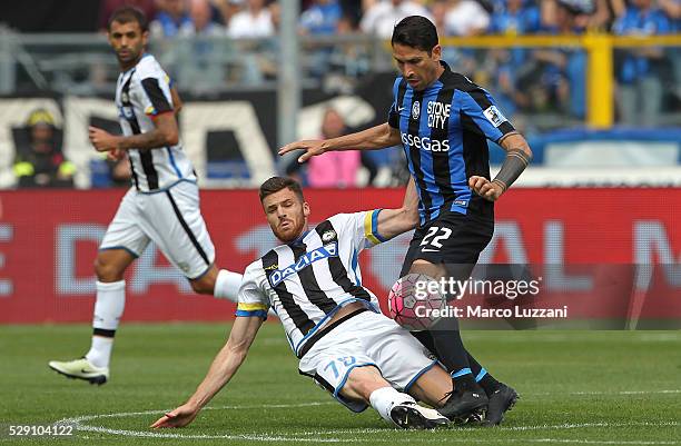 Marco Borriello of Atalanta BC competes for the ball with Thomas Heurtaux of Udinese Calcio during the Serie A match between Atalanta BC and Udinese...