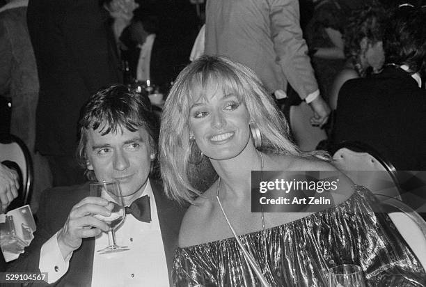Susan Anton with Dudley Moore at a formal dinner; circa 1960; New York.