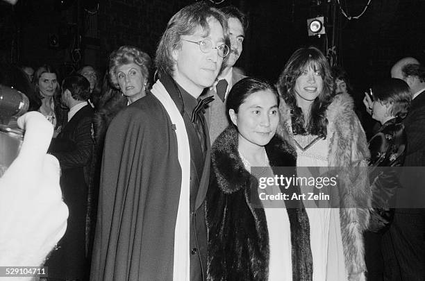 Carly Simon Yoko Ono James Taylor and John Lennon attending a formal event; circa 1960; New York.