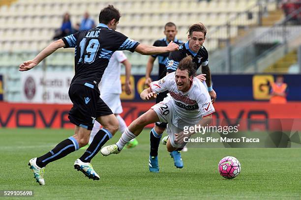 Senad Lulic and Lucas Biglia of SS Lazio compete for the ball with Lorenzo Lollo of Carpi FC during the Serie A match between Carpi FC and SS Lazio...