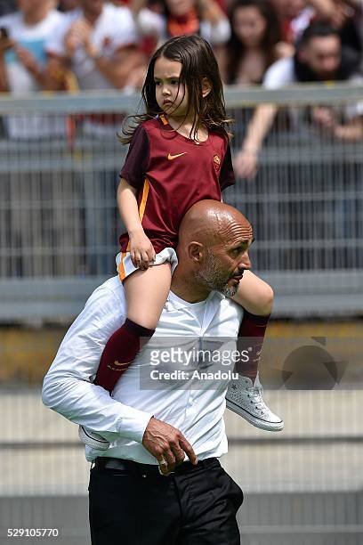 Luciano Spalletti Coach AS Roma carries a girl on his shoulders after winning the Italian Serie A soccer match between AS Roma and AC Chievo Verona...