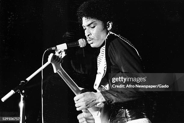 African-American bassist, songwriter and record producer Andre Cymone performing on stage, Washington DC, 1980.