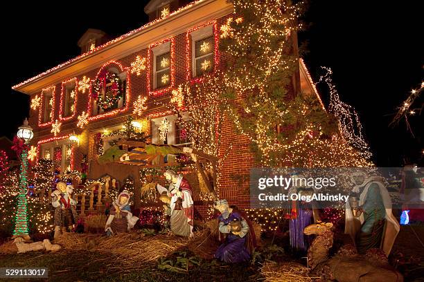 luxury brooklyn house with christmas lights at night, new york. - dyker heights stock pictures, royalty-free photos & images