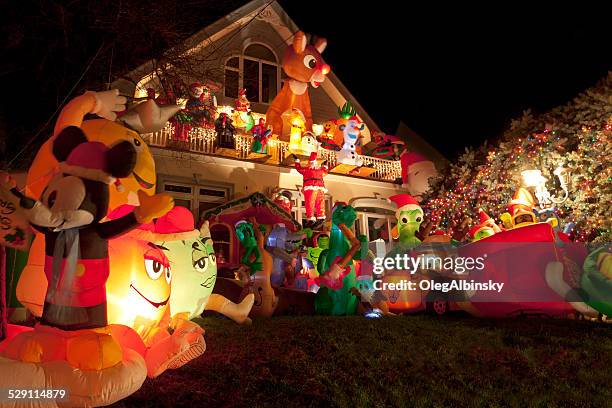 luxury brooklyn house with christmas lights at night, new york. - inflatable santa stock pictures, royalty-free photos & images