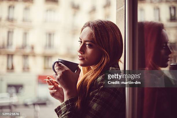attractive woman drinking coffee on the window - beautiful women smoking cigarettes 個照片及圖片檔