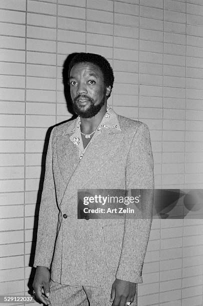 Paul Winfield wearing a double breasted suit and open collar. Taken inside; circa 1970; New York.