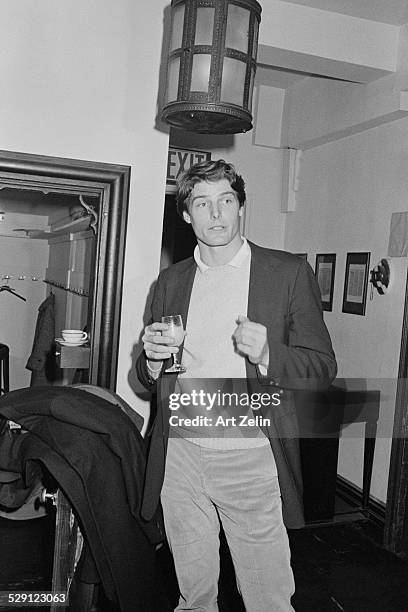 Christopher Reeve with a glass of wine; circa 1970; New York