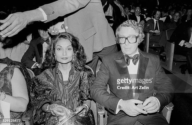 Shakira Caine with her husband Michael seated at at theater; circa 1970; New York