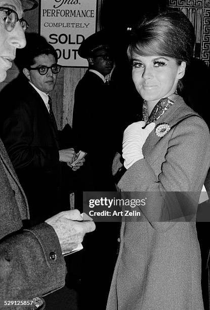 Ann-Margret wearing a pearl pin and white gloves; circa 1970; New York