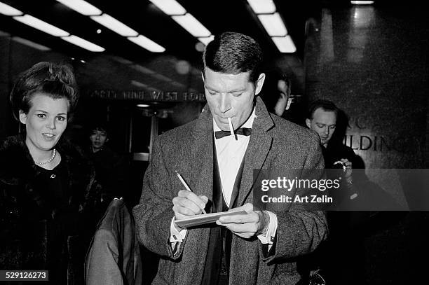 Steven Boyd signing autographs; circa 1970; New York.