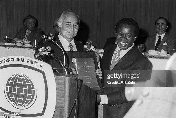 Flip Wilson receiving an award; circa 1970; New York.