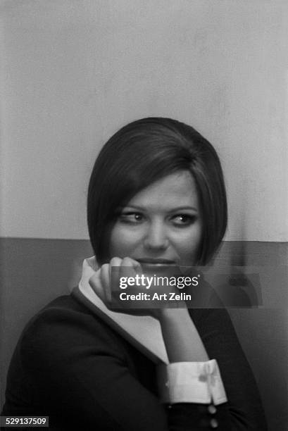 Claudia Cardinale, smiling in white collar and cuffs; circa 1970; New York.