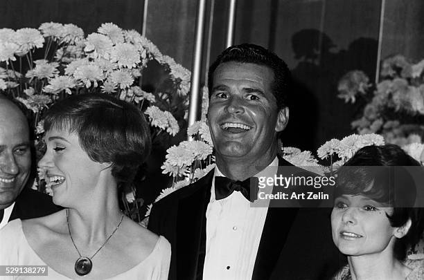 James Garner and his wife Julie Andrews on the right at a formal event; circa 1970; New York.