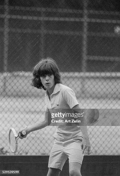 John F. Kennedy, Jr. Playing tennis in Central Park; circa 1970; New York.