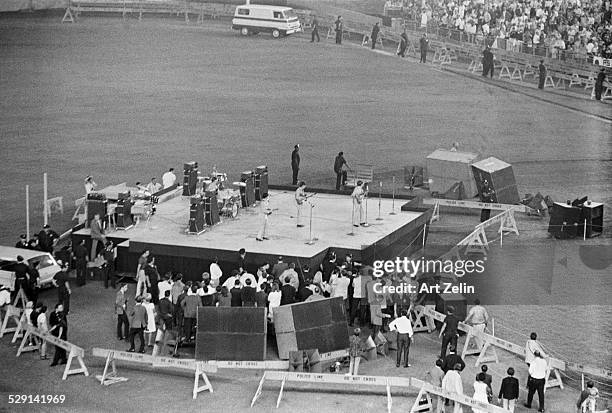 The Beatles in performance at Shea Stadium, August 1965; New York.