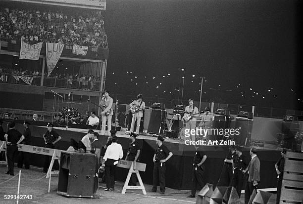 The Beatles in performance at Shea Stadium, August 1965; New York.