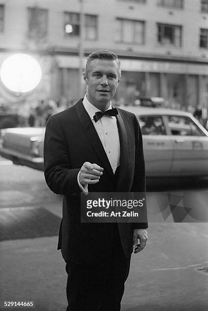 George Peppard in a tux arriving at an event; circa 1970; New York.