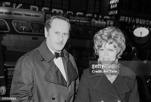 Eli Wallach with his wife Anne Jackson going to a formal event; circa 1970; New York.