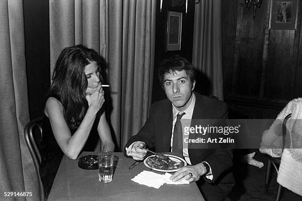 Dustin Hoffman with his first wife Anne Byrne eating at a restaurant; circa 1970; New York.
