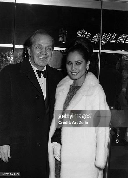 Joey Adams with Cindy Adams his wife in formal dress; circa 1970; New York.