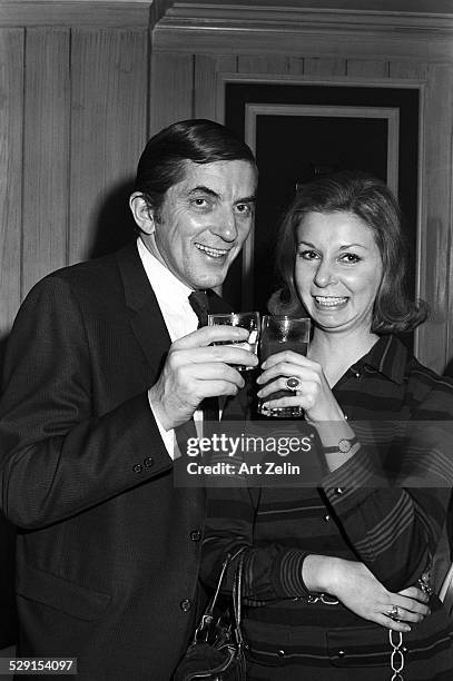 Jonathan Frid having drinks with a young lady; circa 1970; New York.