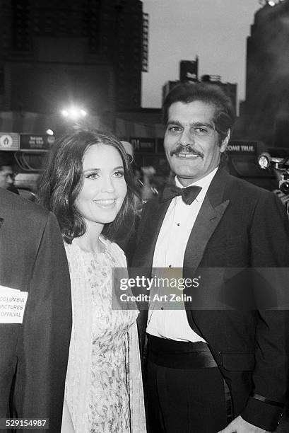 Omar Sharif with anjanette Comer posing for photos before a formal event; circa 1970; New York.