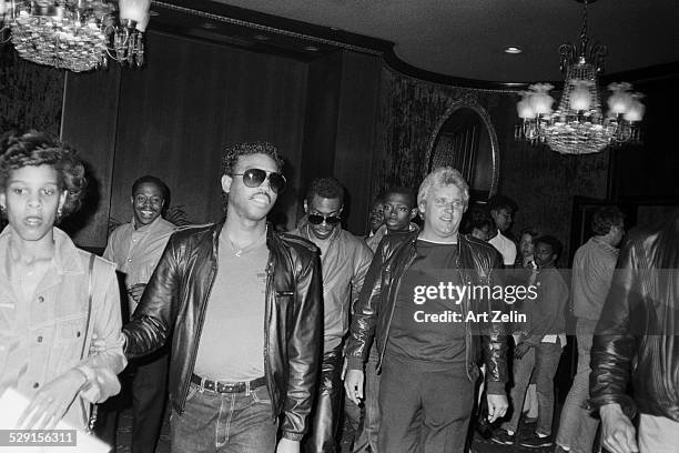 Eddie Murphy center wearing a leather jacket; circa 1970; New York.