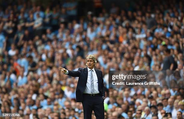 Manuel Pellegrini, Manager of Manchester City gestures from the touchline during the Barclays Premier League match between Manchester City and...