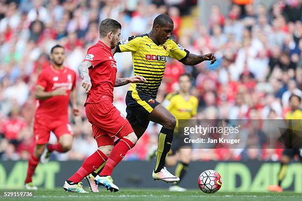 Odion Ighalo of Watford holds off Alberto Moreno of Liverpool during the Barclays Premier League match between Liverpool and Watford at Anfield on...