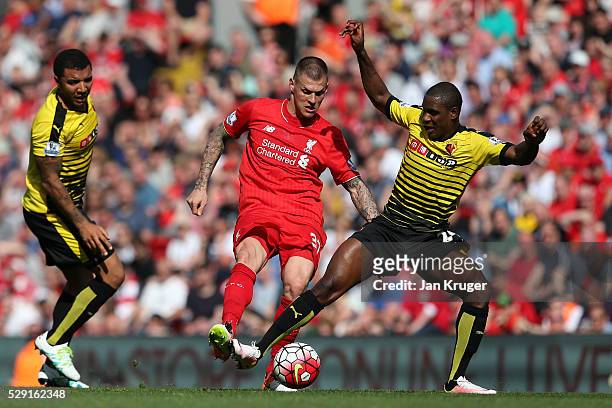 Martin Skrtel of Liverpool battles for the ball with Odion Ighalo of Watford during the Barclays Premier League match between Liverpool and Watford...