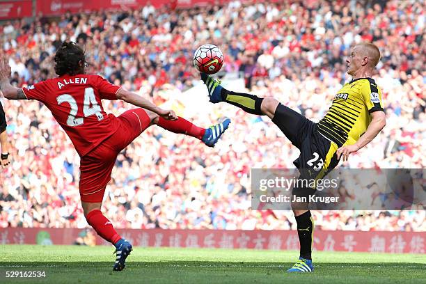 Ben Watson of Watford battles for the ball with Joe Allen of Liverpool during the Barclays Premier League match between Liverpool and Watford at...