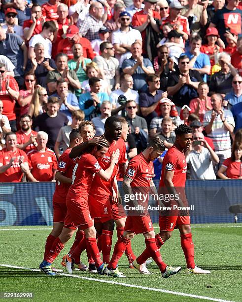 Joe Allen of Liverpool is congratulated after his goal during the Barclays Premier League match between Liverpool and Watford at Anfield on May 08,...