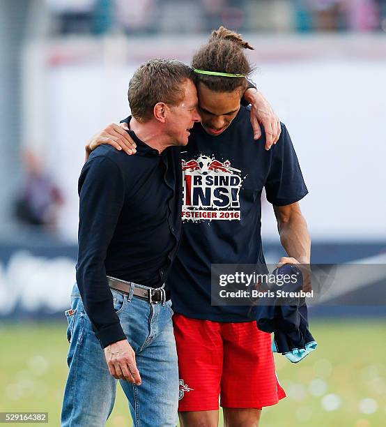 Yussuf Poulsen of Leipzig and head coach Ralf Rangnick celebrate promotion to the first Bundesliga after winning the Second Bundesliga match between...