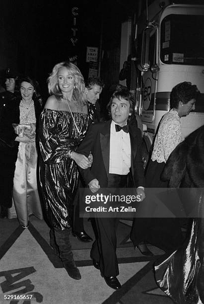 Susan Anton with Dudley Moore on their way to a formal event.; circa 1970; New York.