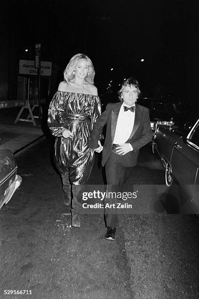 Susan Anton with Dudley Moore in formal dress; circa 1970; New York.