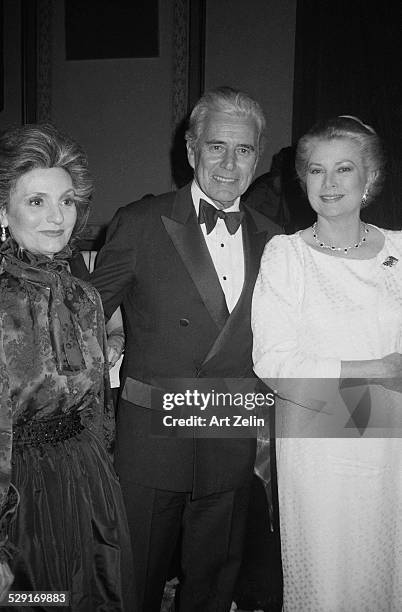 Grace Kelly; John Forsyth and his wife Julie Warren Wagner attending a formal event; circa 1970; New York.
