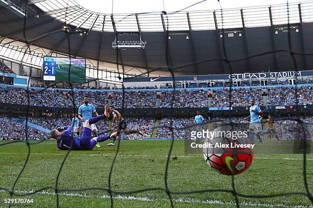 Alexis Sanchez of Arsenal scores his side's second goal past Joe Hart of Manchester City during the Barclays Premier League match between Manchester...