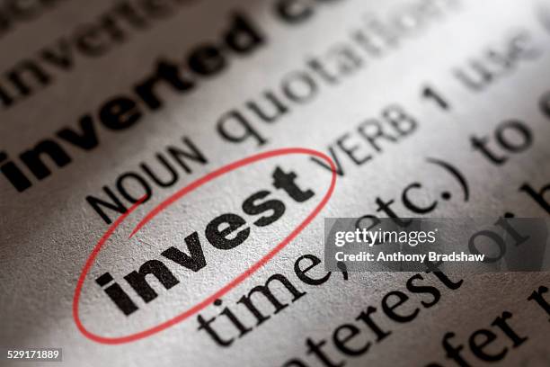 dictionary entry for the word invest - dictionary entry stock pictures, royalty-free photos & images