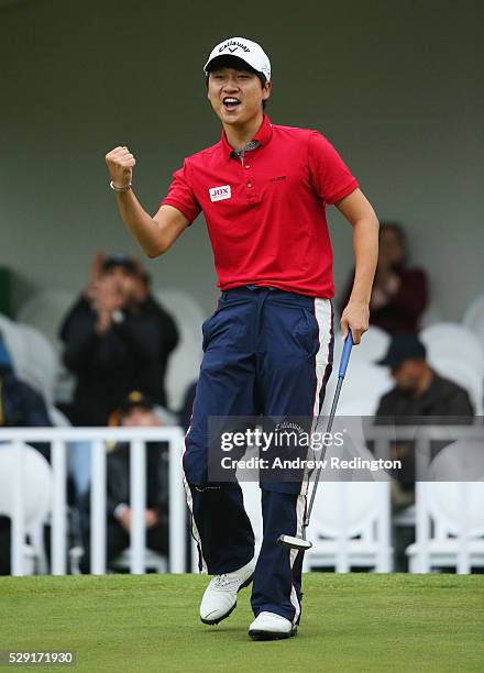 Jeunghun Wang of Korea celebrates a birdie putt on the first hole of the play off with Nacho Elvira of Spain during the fourth and final round of the...