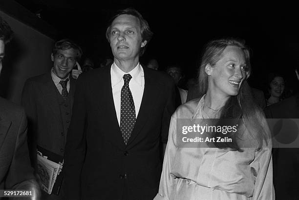 Meryl Streep with Alan Alda walking to an event; circa 1970; New York.