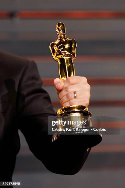 Hand holding an Oscar statue Vanity Fair Oscar Party 2015 Beverly Hills, CA February 22, 2015 ��Kurt Krieger
