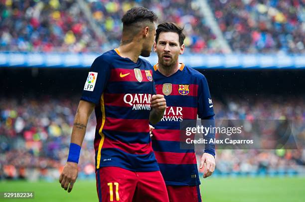 Lionel Messi of FC Barcelona speaks to his teammate Neymar Santos Jr during the La Liga match between FC Barcelona and RCD Espanyol at Camp Nou on...