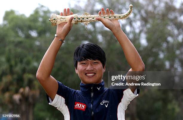 Jeunghun Wang of Korea poses with the dagger trophy after winning the Trophee Hassan II at Royal Golf Dar Es Salam on May 8, 2016 in Rabat, Morocco.