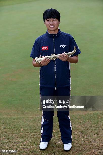 Jeunghun Wang of Korea poses with the dagger trophy after winning the Trophee Hassan II at Royal Golf Dar Es Salam on May 8, 2016 in Rabat, Morocco.